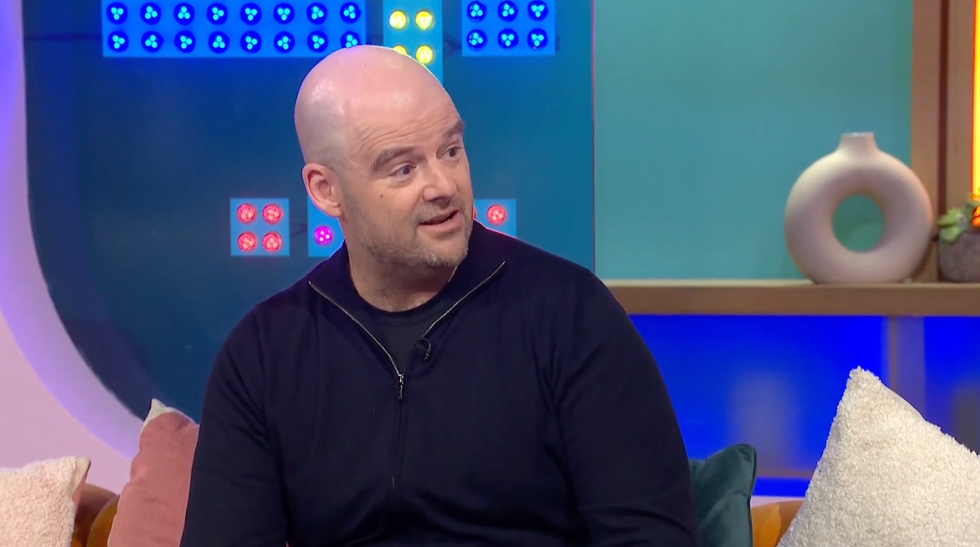 A screenshot of Dan Houser speaking on Channel 4's Sunday Brunch