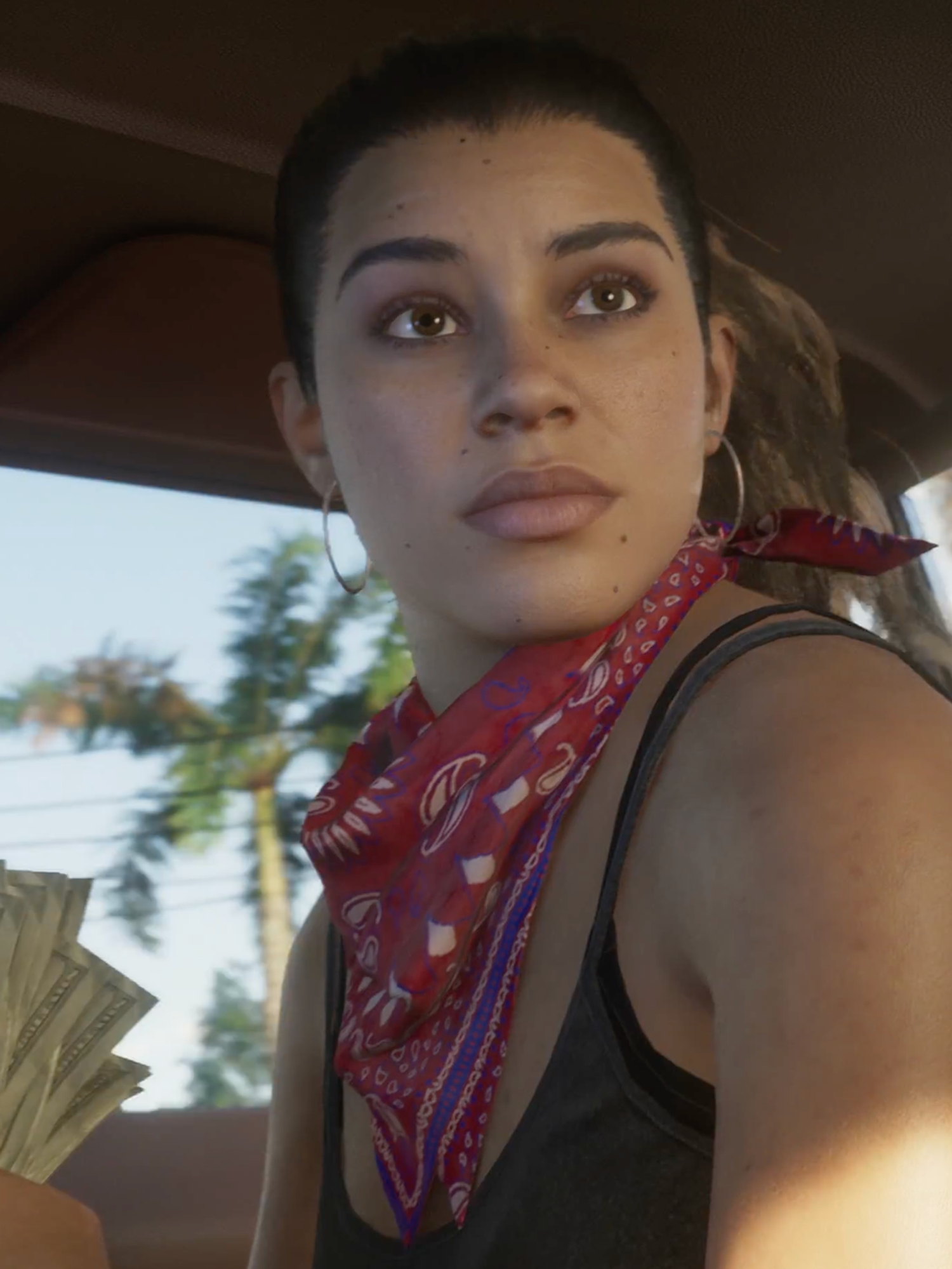 A screenshot of Lucia holding cash from the GTA 6 trailer