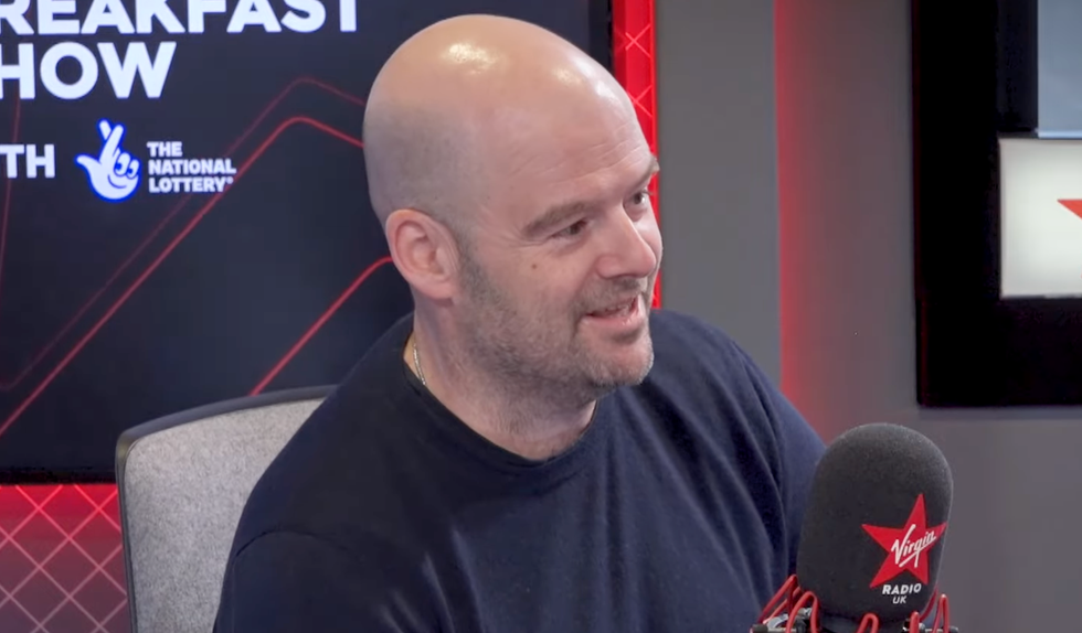 A screenshot of Rockstar Games co-founder speaking on the Chris Evans Breakfast Show