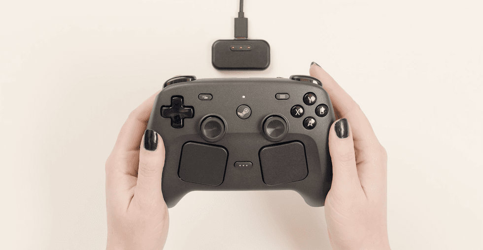 A screenshot of the Steam Controller and Puck from Valve's Official Overview and Quick Start Guide