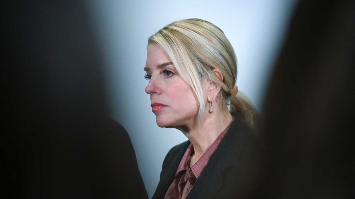 A side profile of Pam Bondi, a white woman with long blonde hair tied back in a ponytail.