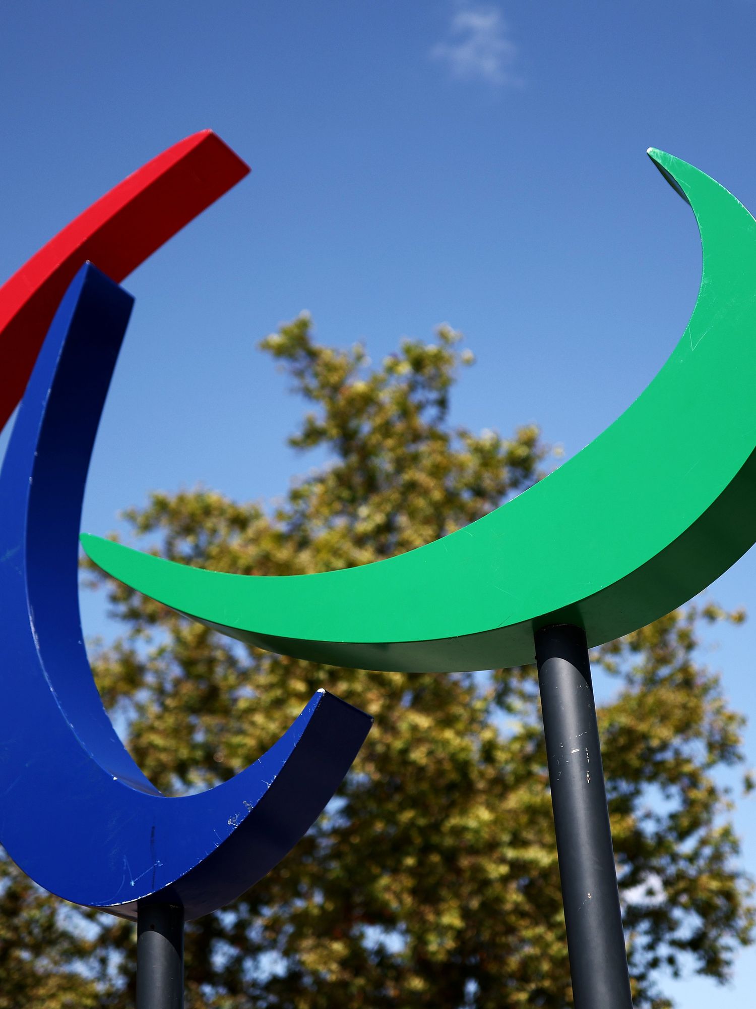 A sign depicting the Paralympics logo - three crescents in red, blue and green - is seen in Paris.