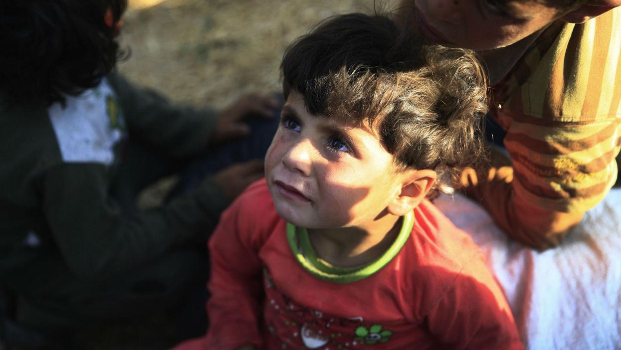 A small boy trapped near Akcakale on the Turkish-Syrian border after fleeing from Isis militants