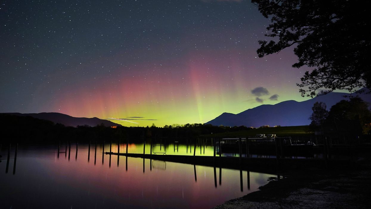 A spectacular display of the Northern Lights seen over Derwentwater, near Keswick in the Lake District (Owen Humphreys/PA)