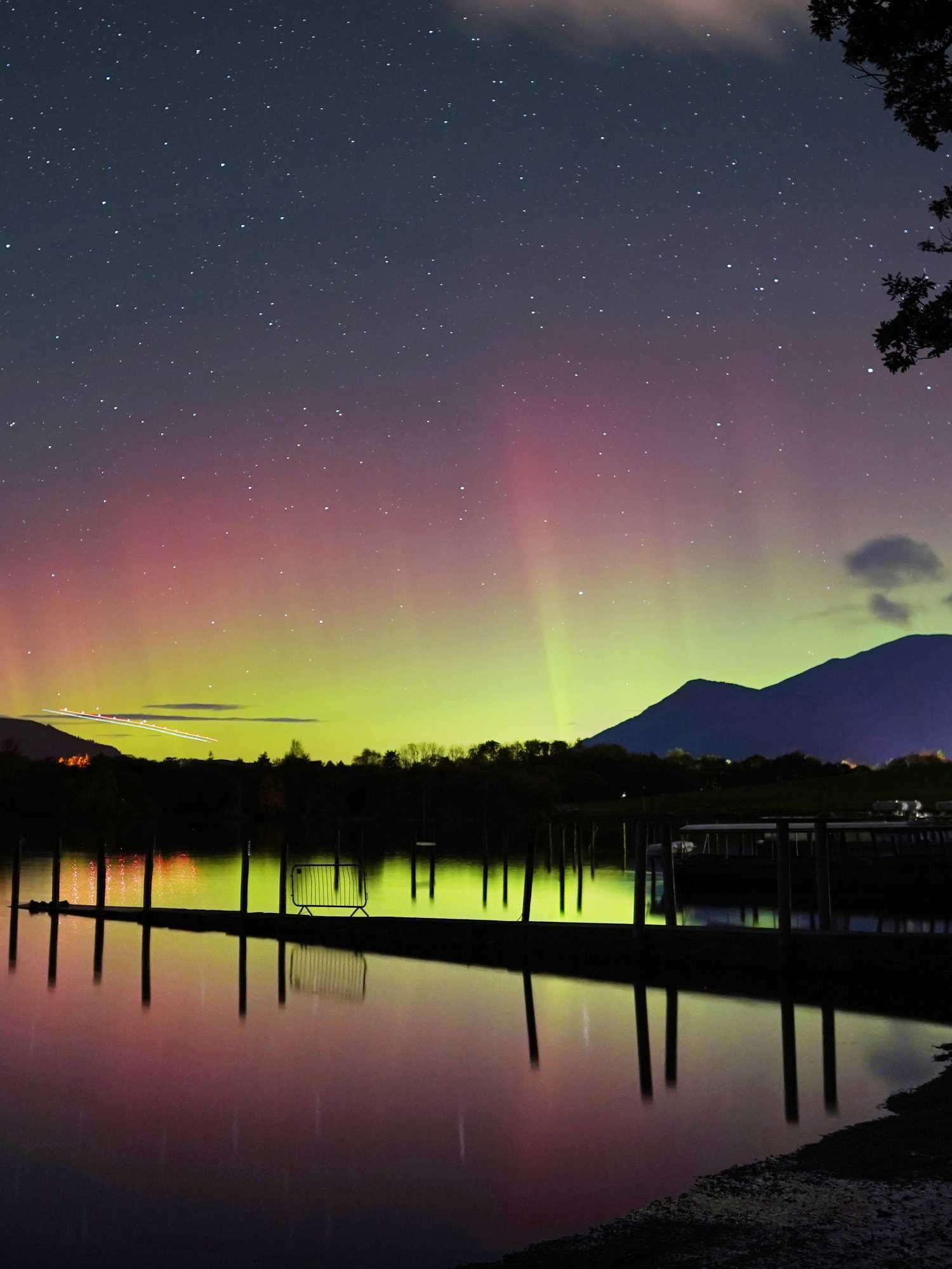 A spectacular display of the Northern Lights seen over Derwentwater, near Keswick in the Lake District (Owen Humphreys/PA)