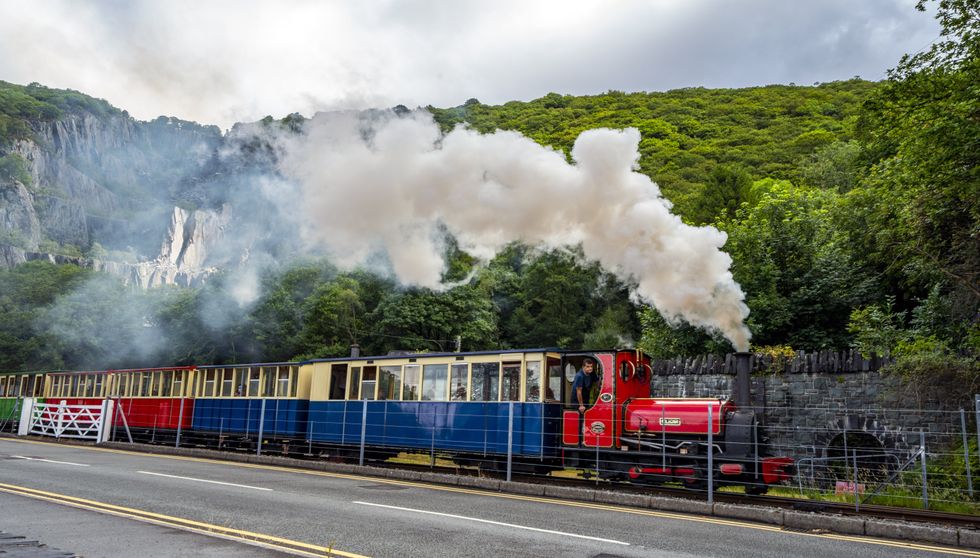 A steam train runs past the north-west Wales slate landscape following the announcement that it has been granted Unesco World Heritage Status (Peter Byrne/PA)