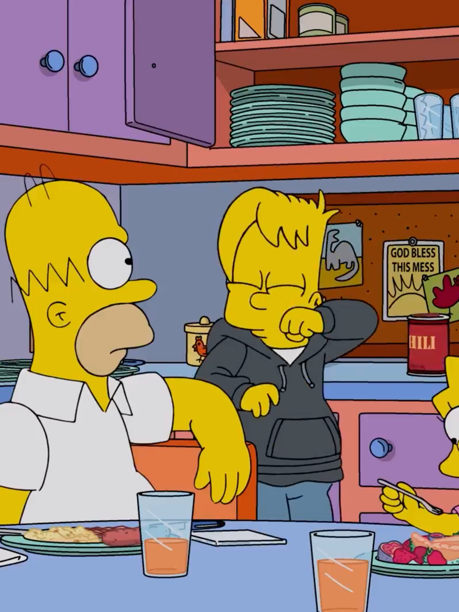 A still from an episode of The Simpsons, showing all five characters in the kitchen.
