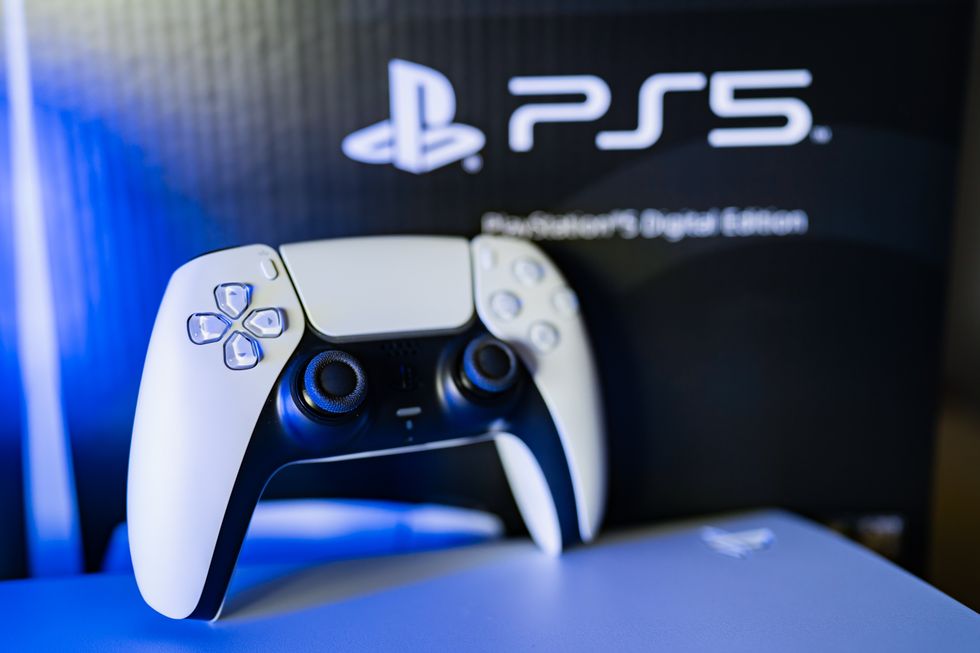 A stock image of a PS5 controller and its box
