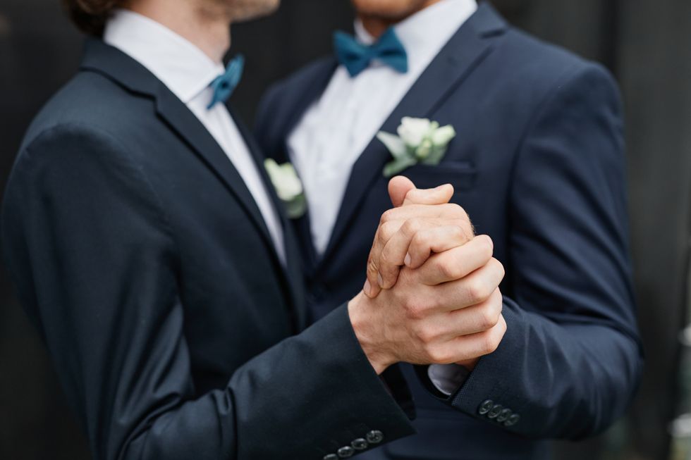 A stock image of a same-sex couple dancing