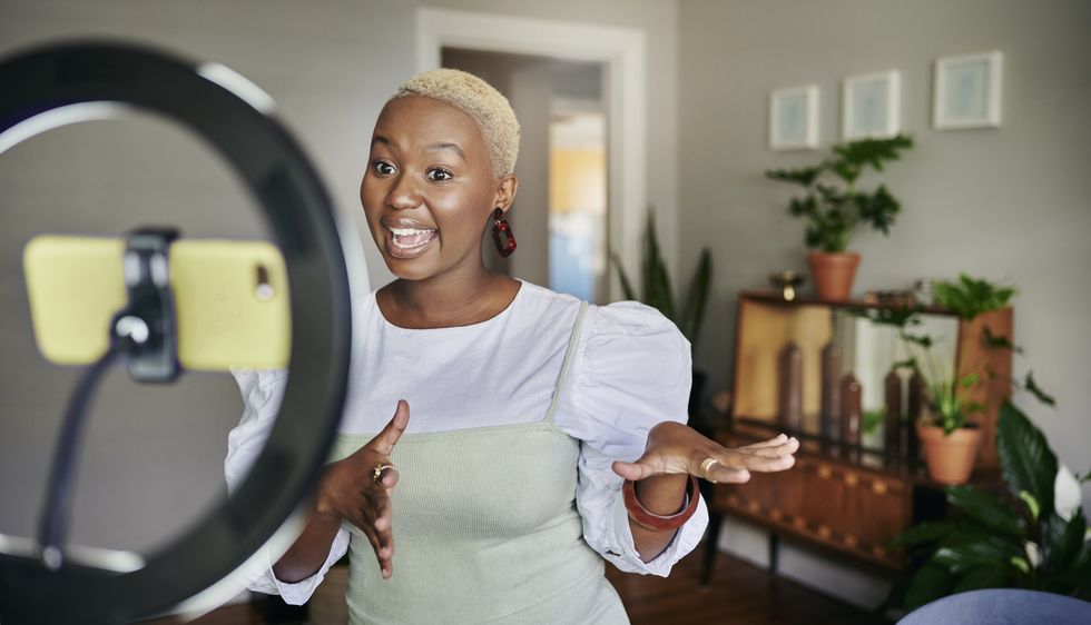 A stock image of a woman livestreaming