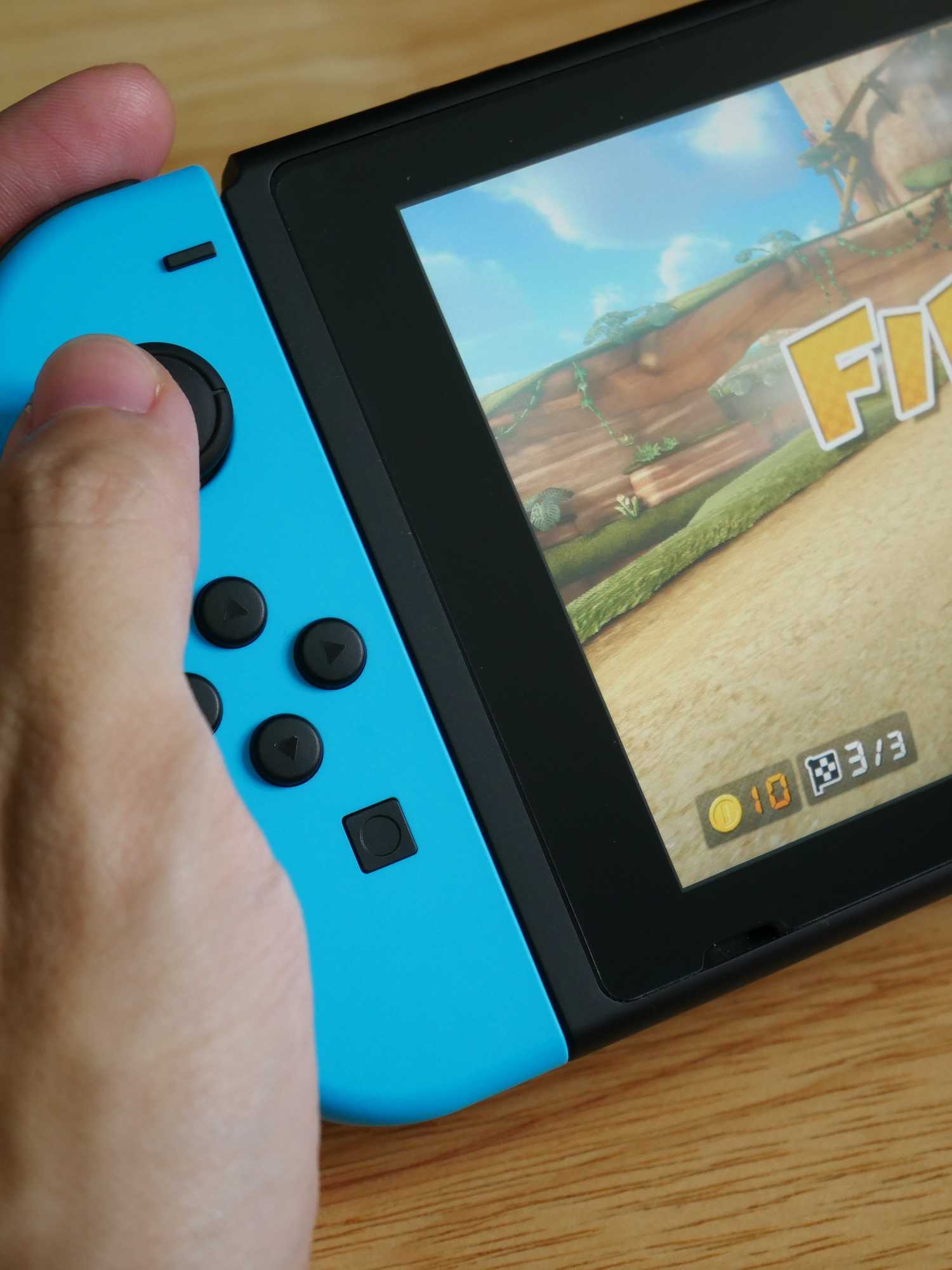 A stock image of someone playing Mario Kart on Nintendo Switch