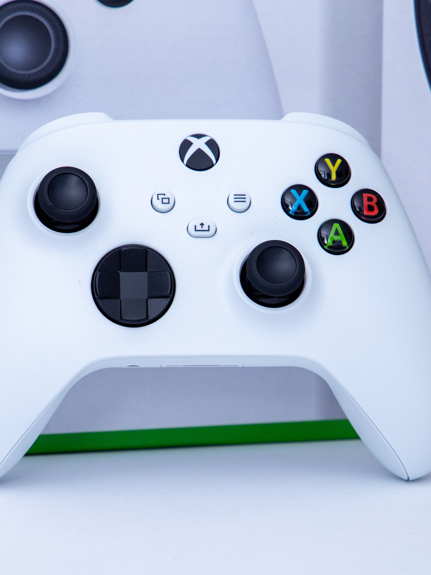 A stock photo of a white controller of video game console Xbox Series S