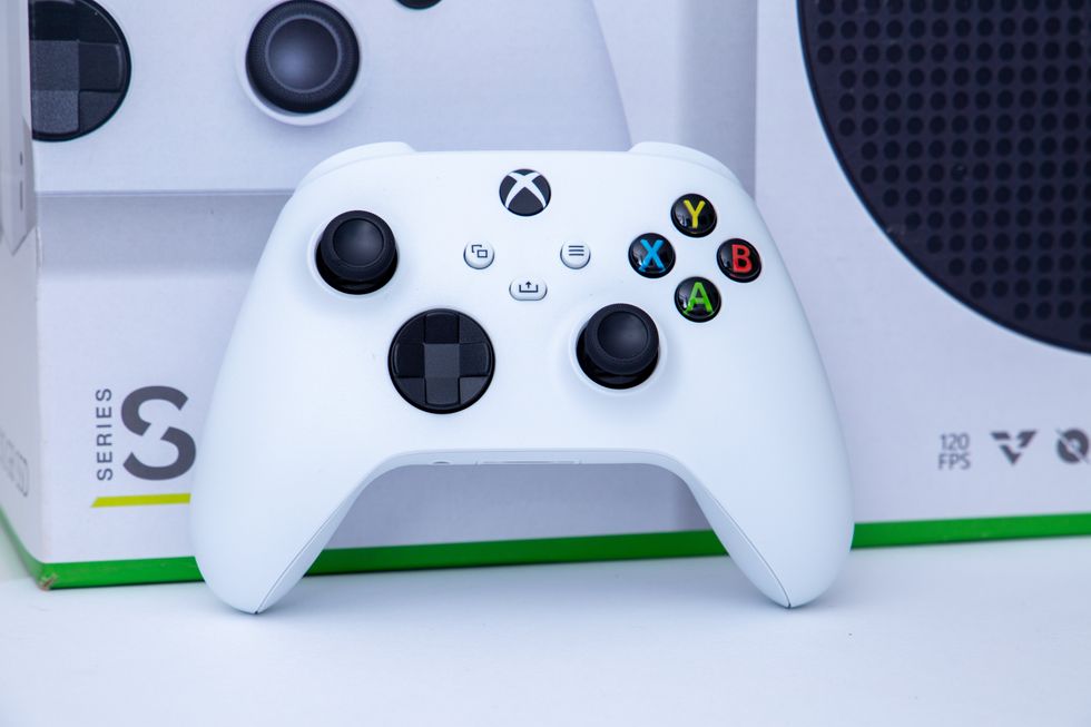 A stock photo of a white controller of video game console Xbox Series S