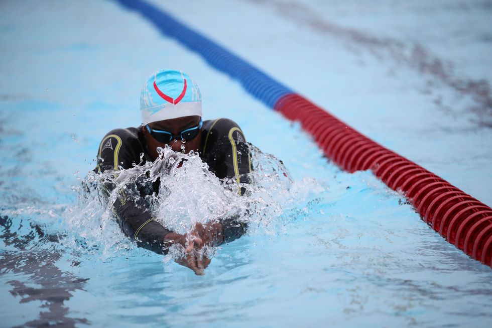 A swimmer in the water at Hillingdon Lido in Uxbridge, west London