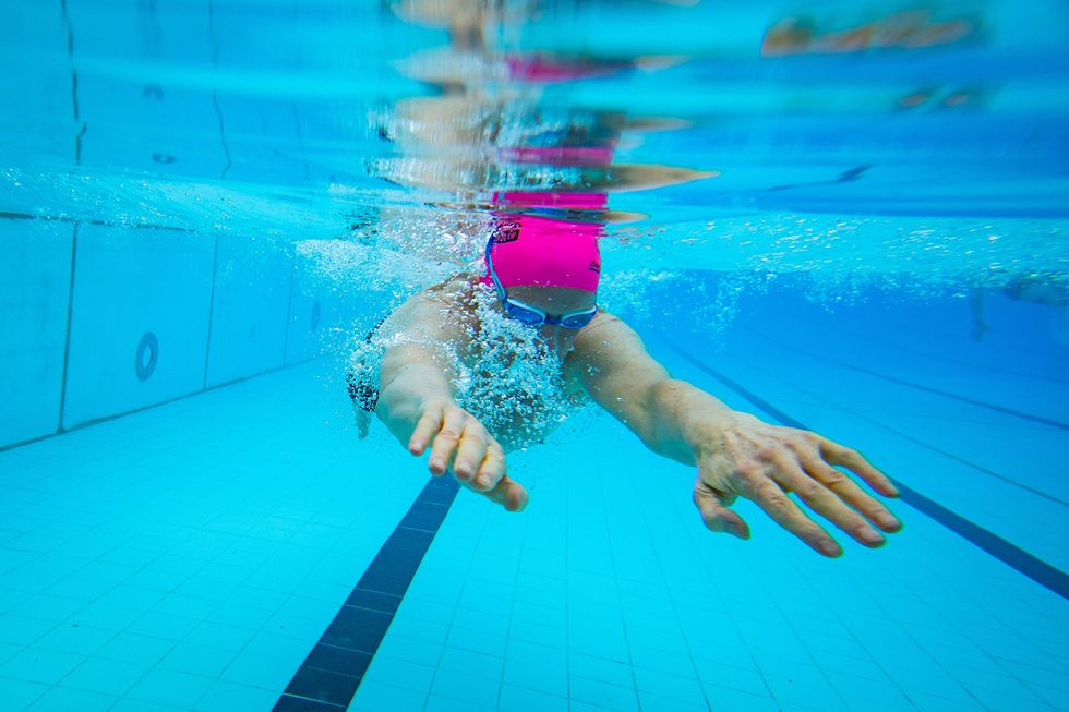 A swimmer in the water at Hillingdon Lido in Uxbridge, west London