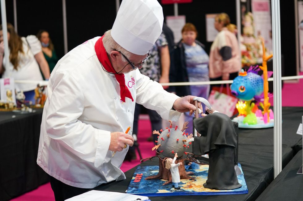A team of judges is assessing the cakes (Jacob King/PA)