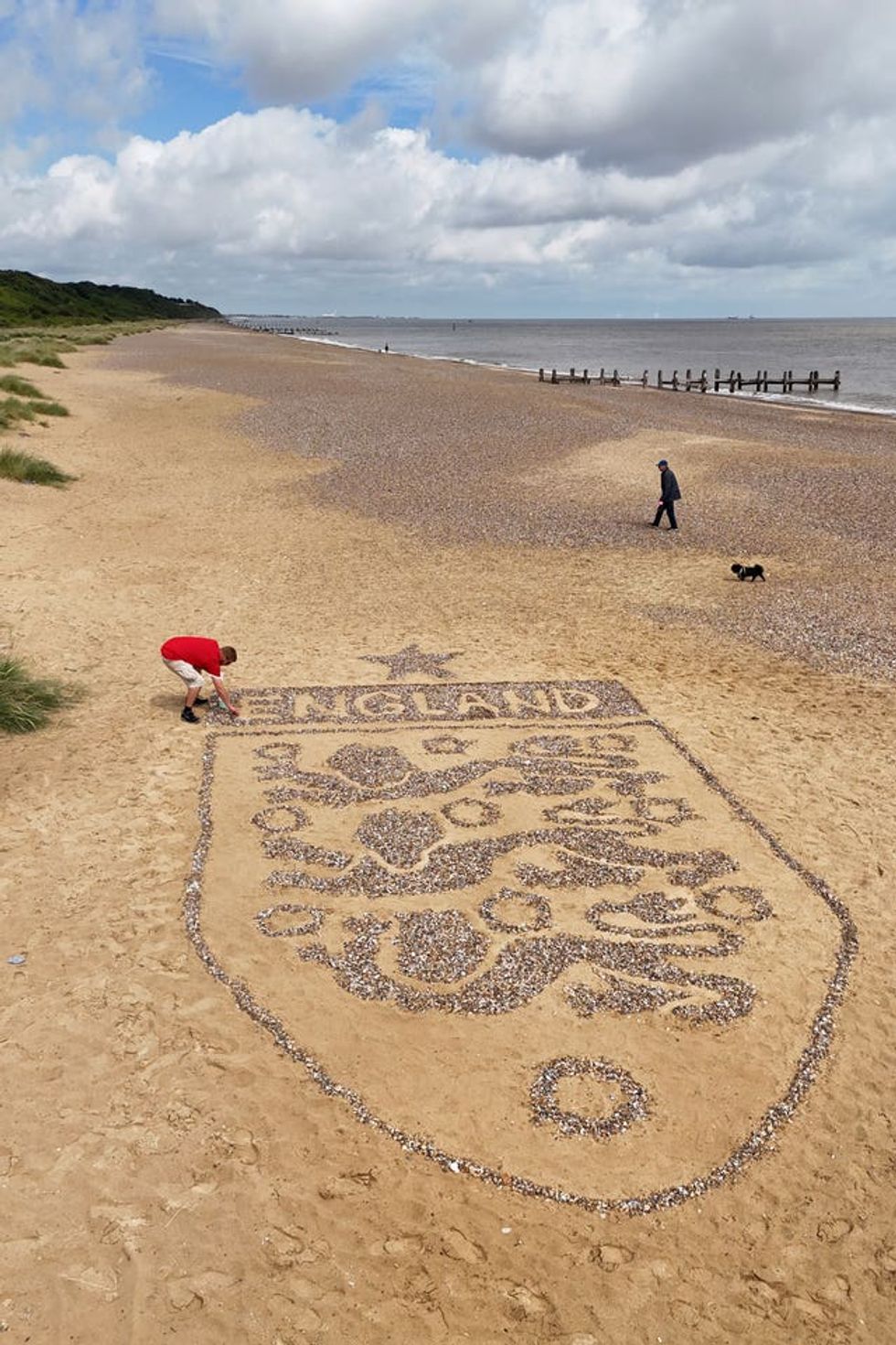 A view of a giant England badge made by artist Toby Clark using stones found on the beach near Lowestoft, Suffolk