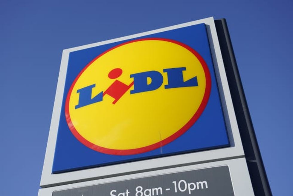 A view of a Lidl sign, under blue skies