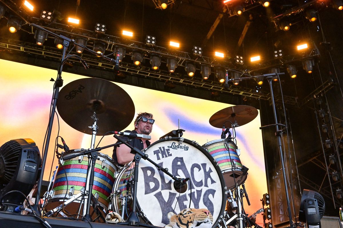A view of The Black Keys drummer Patrick Carney performing on stage