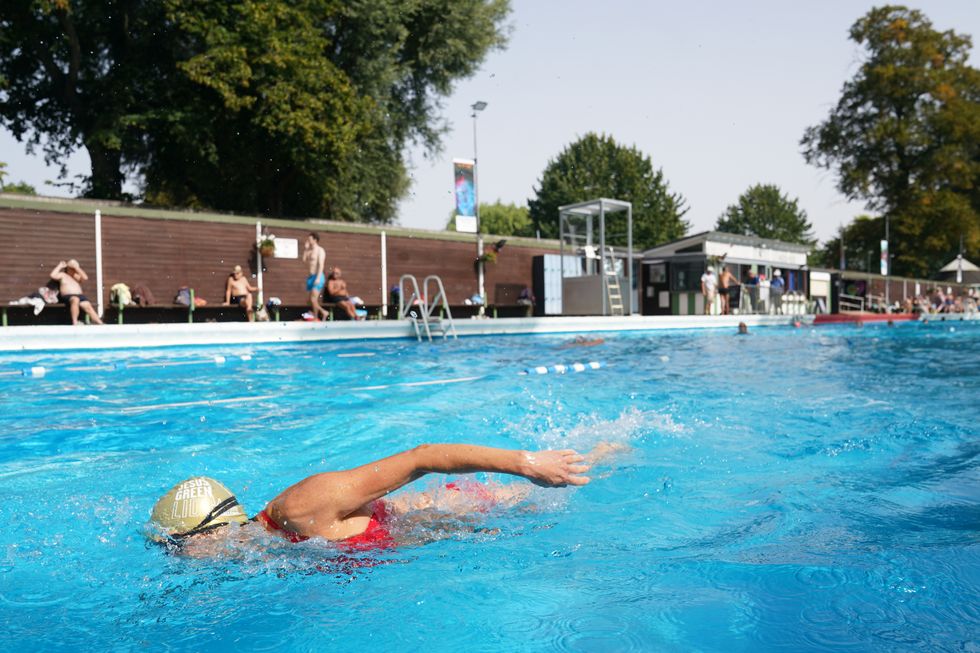 Swimmers enjoy sunshine and a dip at lido celebrating 100th anniversary