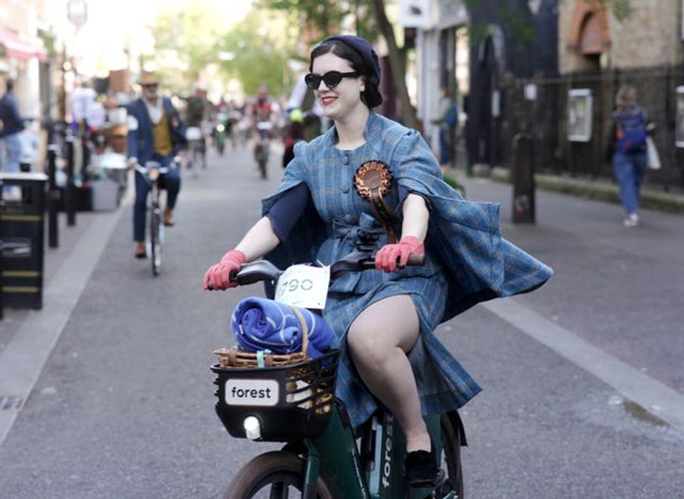 A woman in a tweed cape