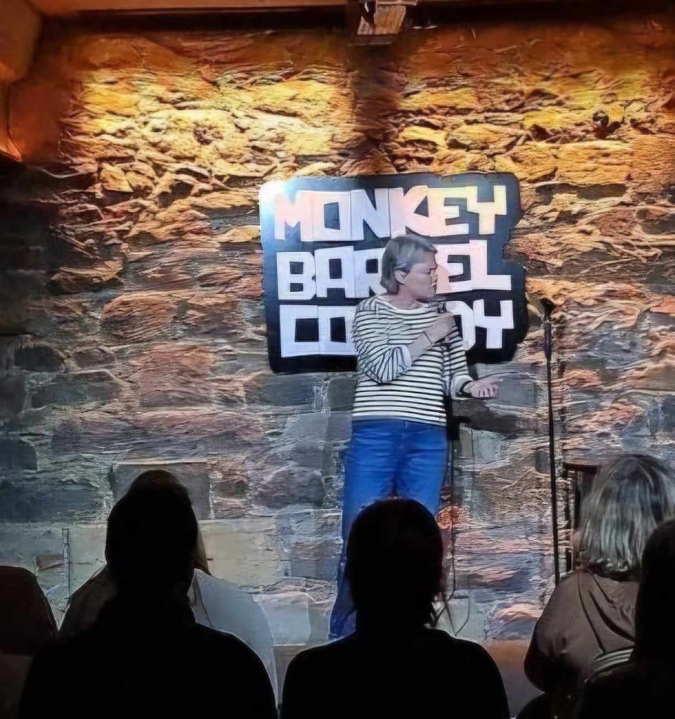A woman performing stand up comedy