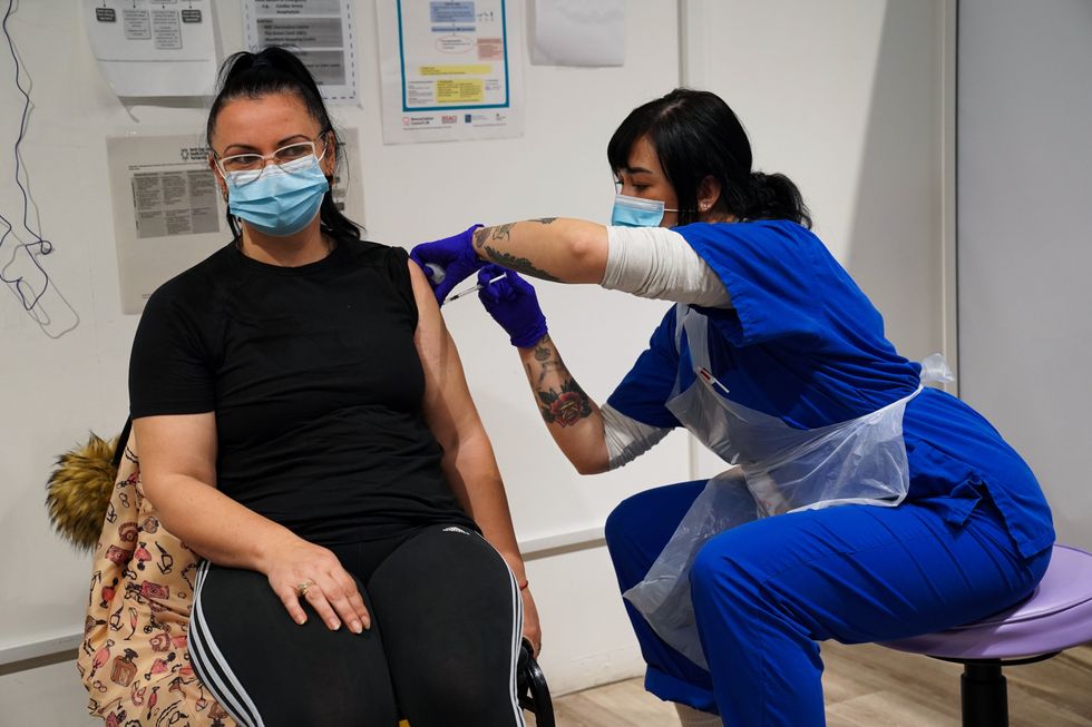 A woman receives a jab at the vaccination centre (Kirsty O\u2019Connor/PA)