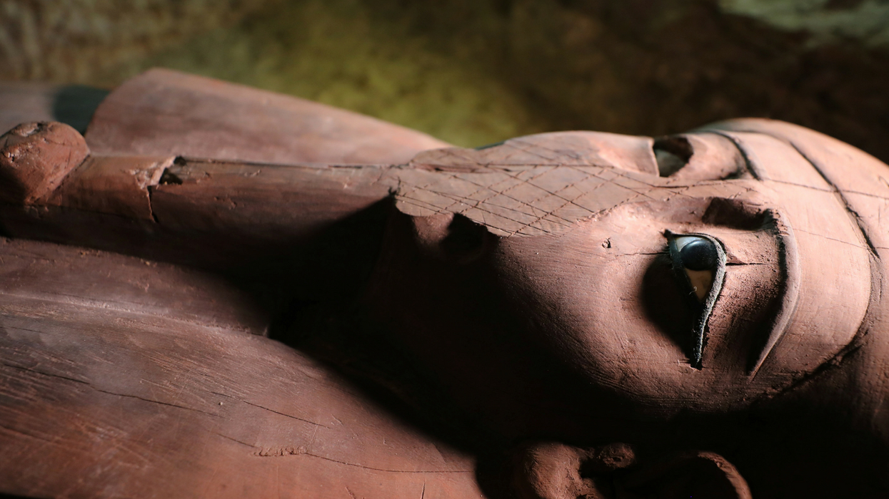 A wooden coffin inside the recently discovered burial site in Minya.