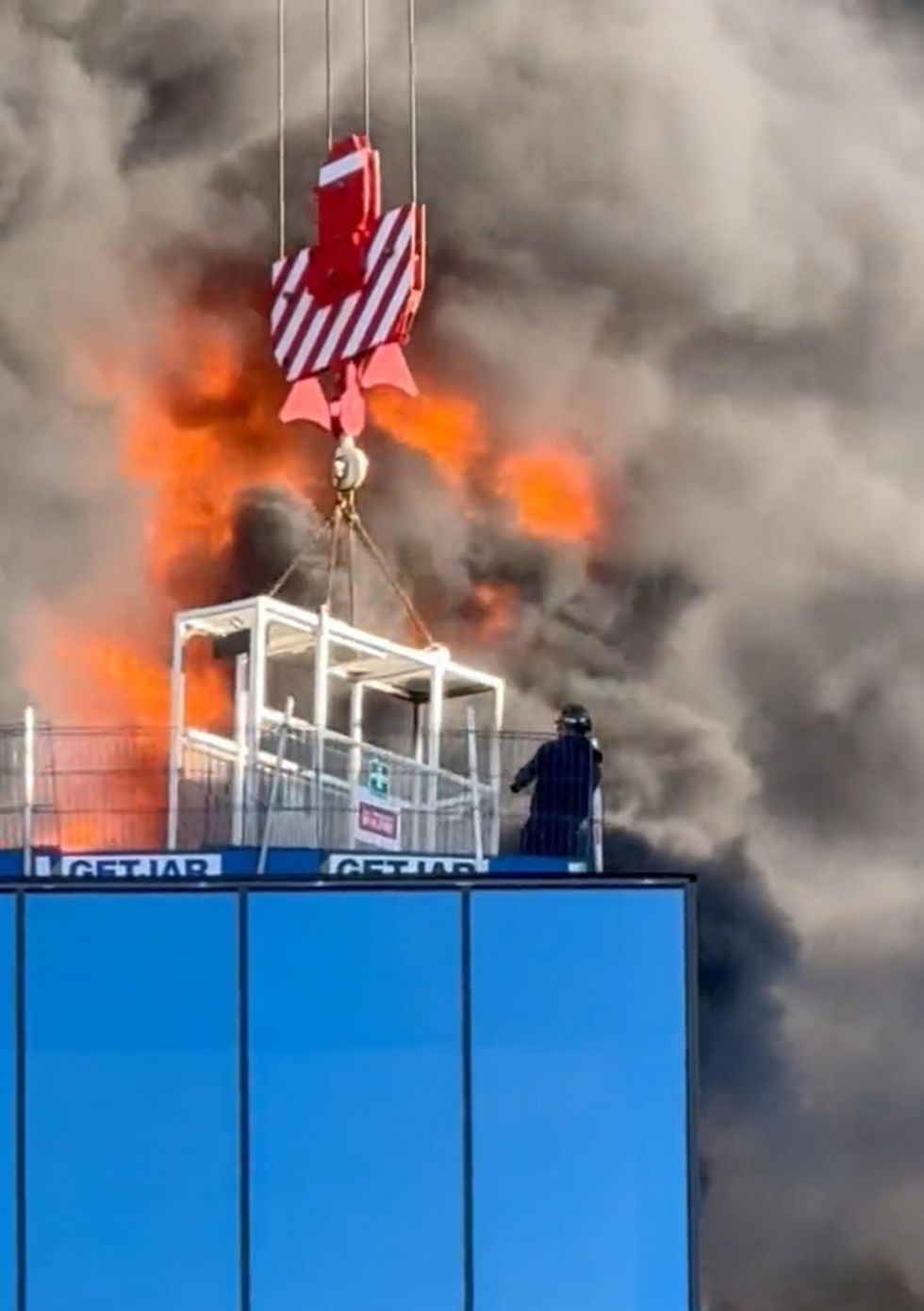 Crane worker praised for rescuing man from burning building