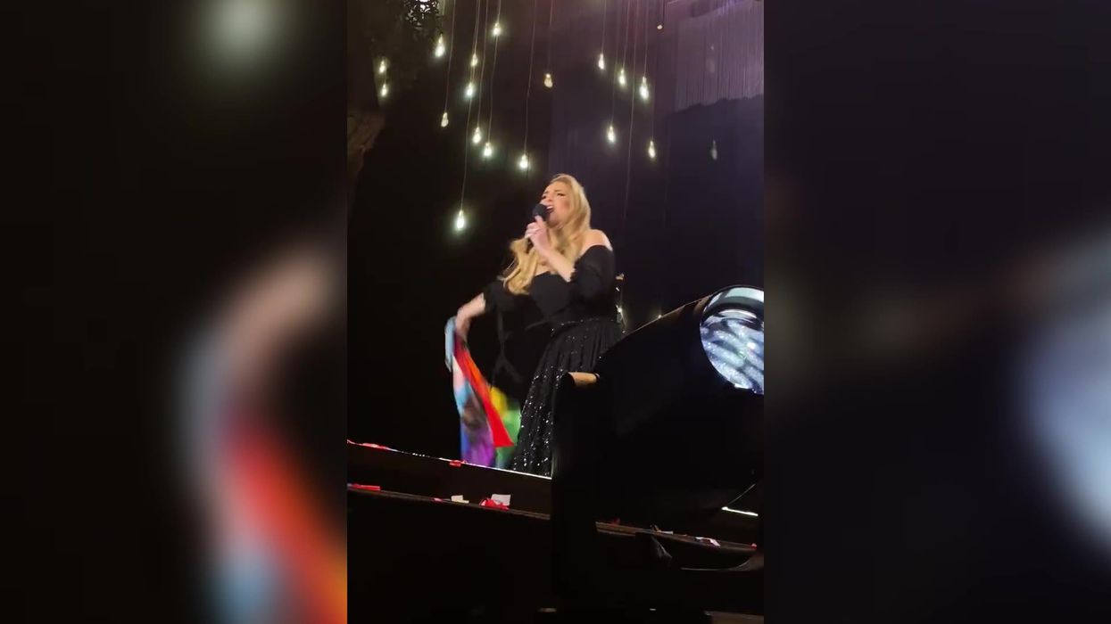 Adele fan gets VIP treatment as singer borrows Pride flag during concert