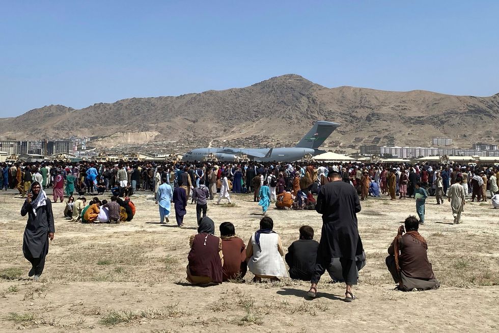 Afghans have athered in their thousands trying to catch a flight out of Kabul this week (Shekib Rahmani/AP)