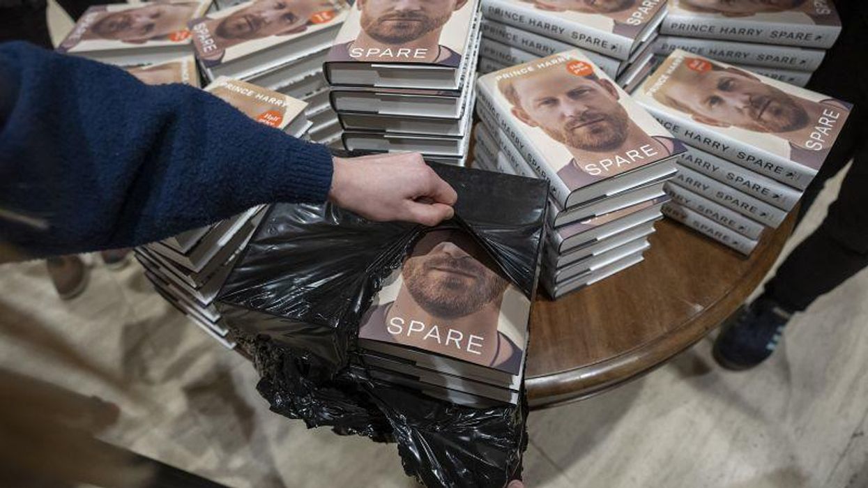 World's media goes wild for one-woman queue to pick up Prince Harry's book