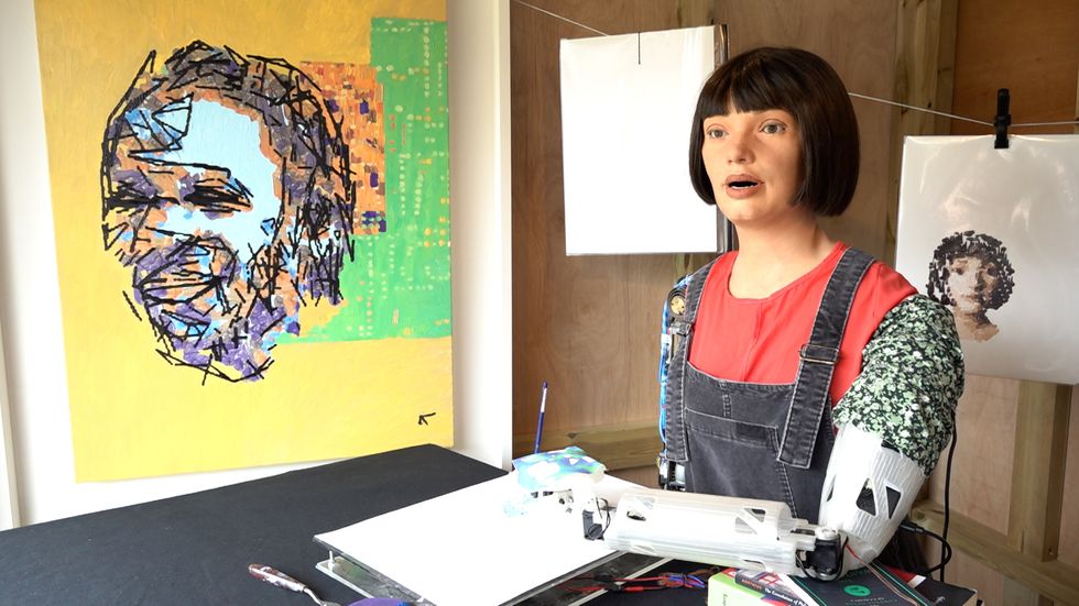 Robot painting Glastonbury’s famous faces says festival atmosphere is ‘electric’