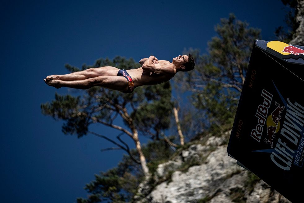 Aidan Heslop of the UK dives from the 27 metre platform during the final competition day of the sixth stop of the Red Bull Cliff Diving World Series in Sisikon, Switzerland on September 11, 2022.