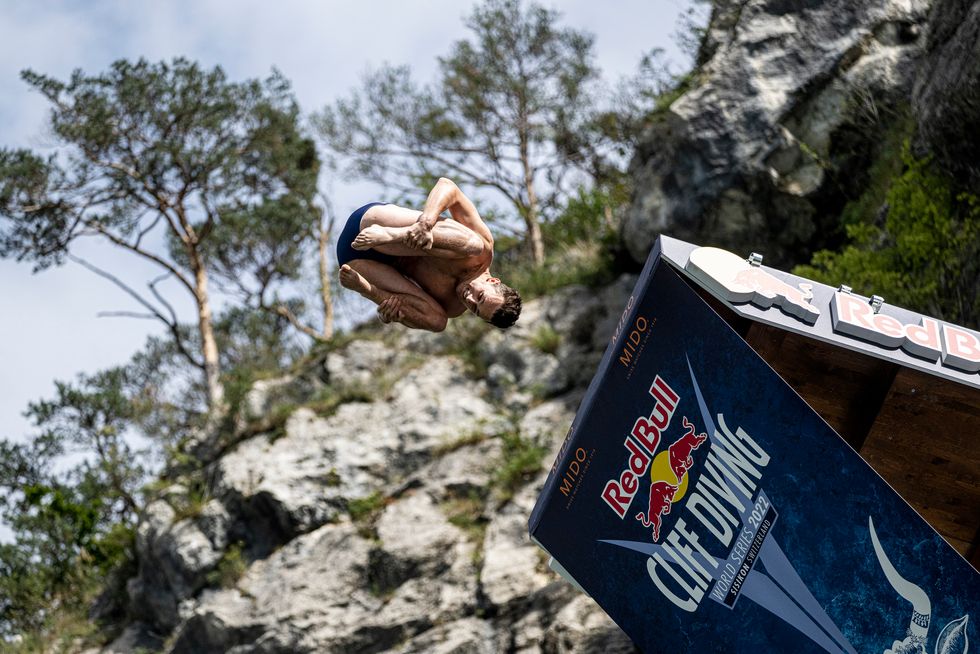 Aidan Heslop of the UK dives from the 27 metre platform during the final competition day of the sixth stop of the Red Bull Cliff Diving World Series in Sisikon, Switzerland on September 11, 2022.