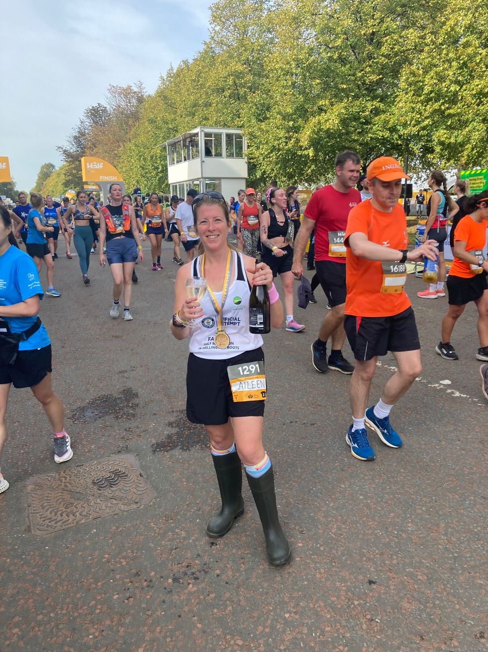 Aileen celebrating at the finish line