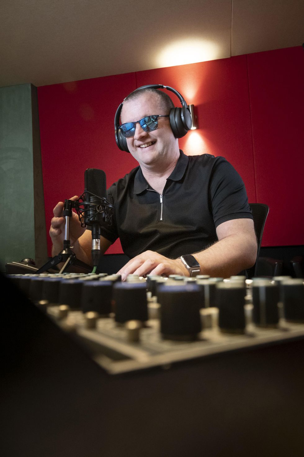Alan Macdonald smiling while recording his voice