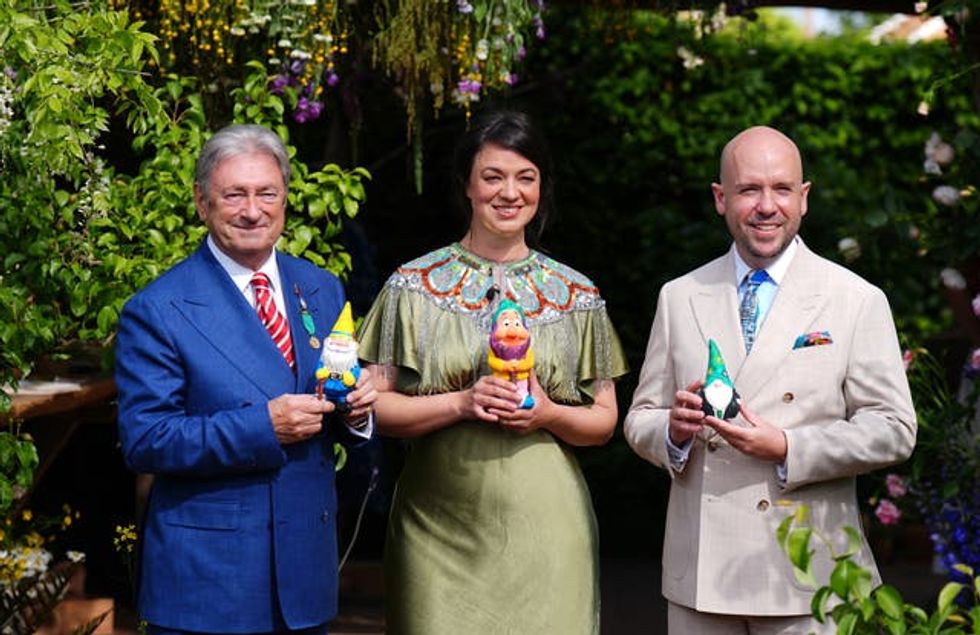 Alan Titchmarsh, Frances Tophill and Tom Allen holding the gnomes they have painted to raise money for the RHS Campaign for School Gardening, at the RHS and The King\u2019s Foundation Curious Garden exhibit, during press day at the RHS Chelsea Flower Show, at the Royal Hospital Chelsea in London