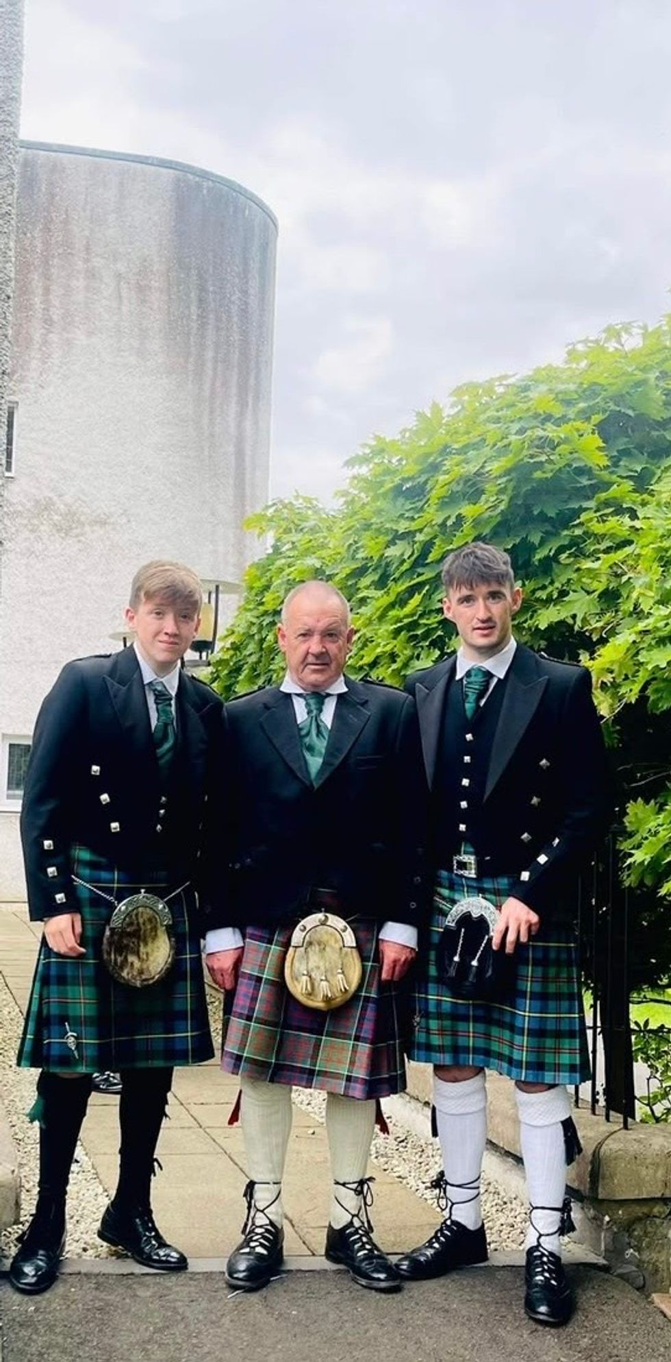Alasdair Iain (right) with his brother Andrew James (left) and father Donald (centre)