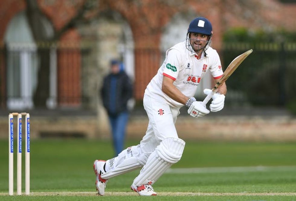 Alastair Cook runs on a cricket pitch