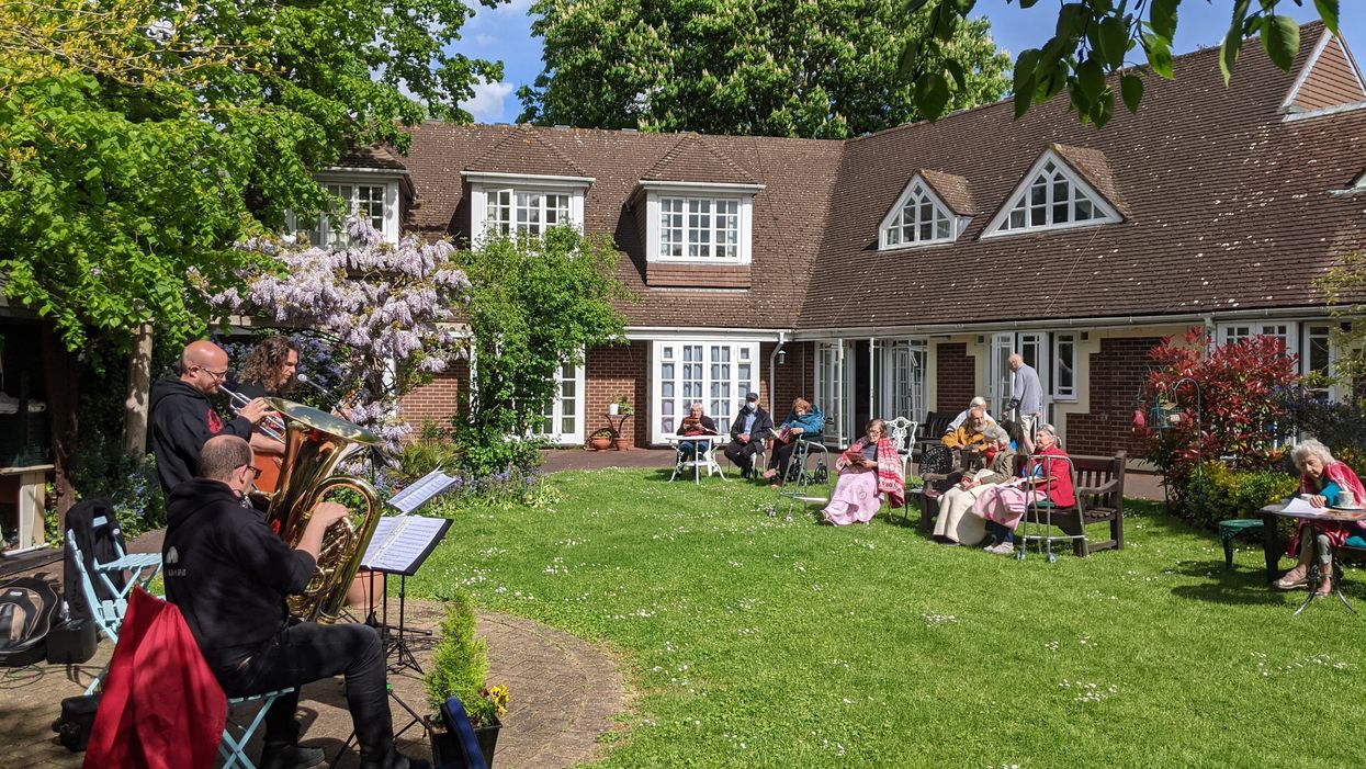Albert's Band perform to residents in the garden at Compton Lodge care home