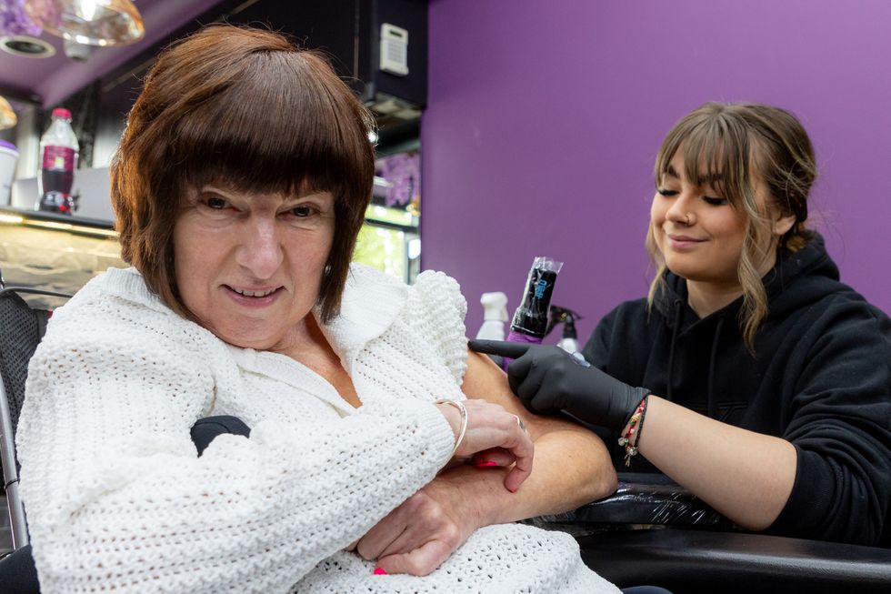 Care home resident and staff fulfil dream with matching tattoos for charity