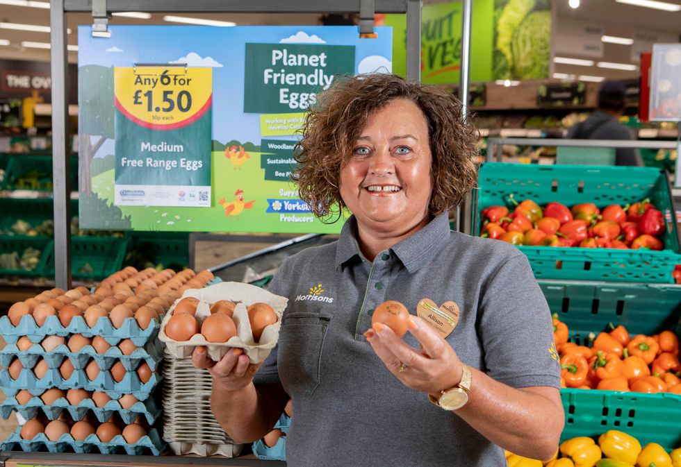 Allison Audsley holds a \u2018Planet Friendly Egg\u2019 at a branch of Morrisons near Hull (Lucy Ray/PA)
