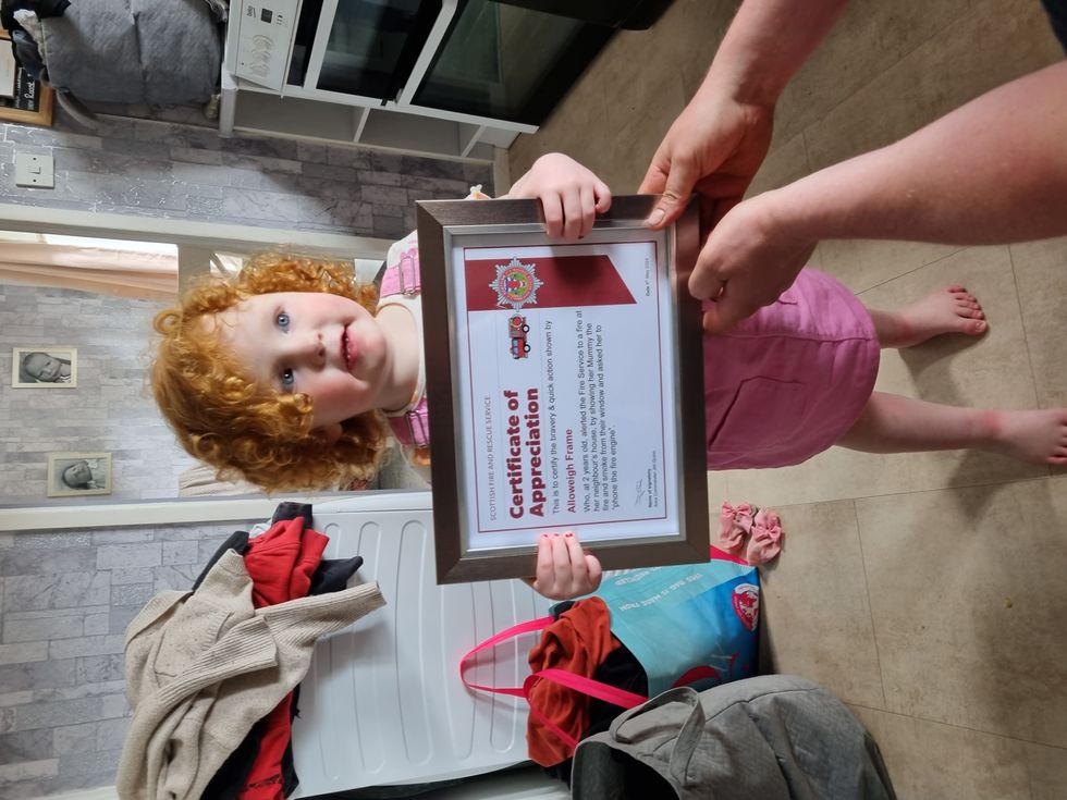 Two-year-old honoured for quick-thinking after neighbours saved from fire