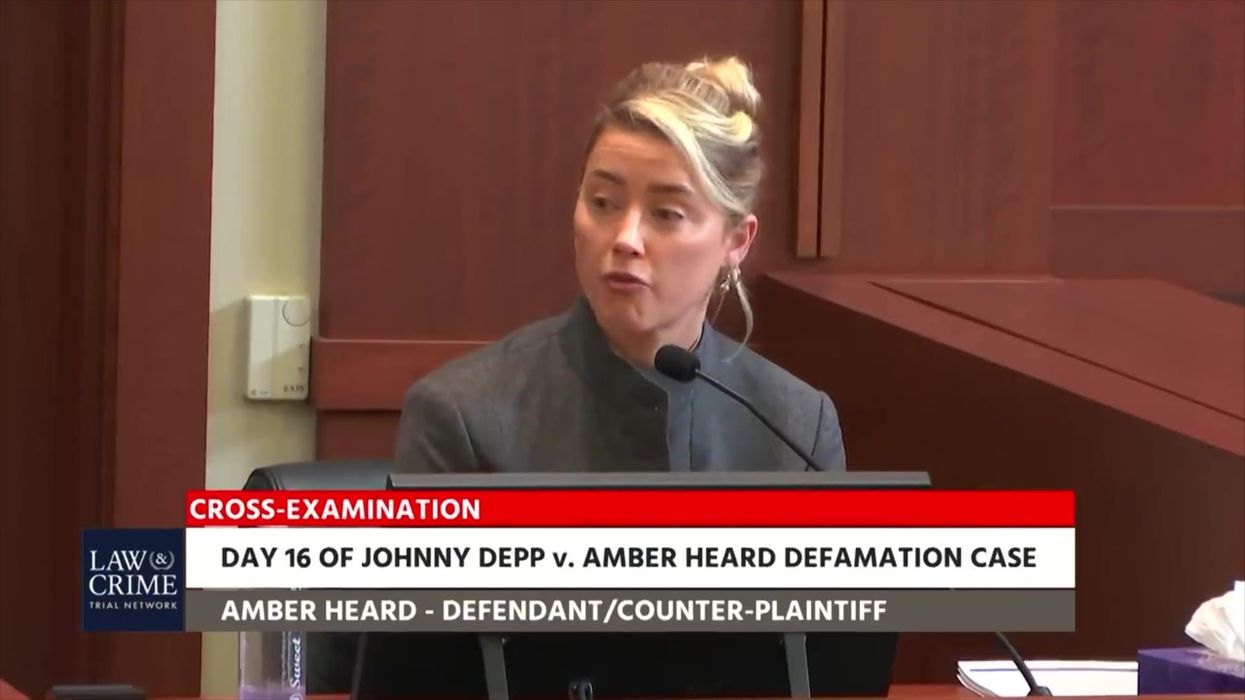 Awkward moment Amber Heard and Depp's lawyer argue over what 'donate' means