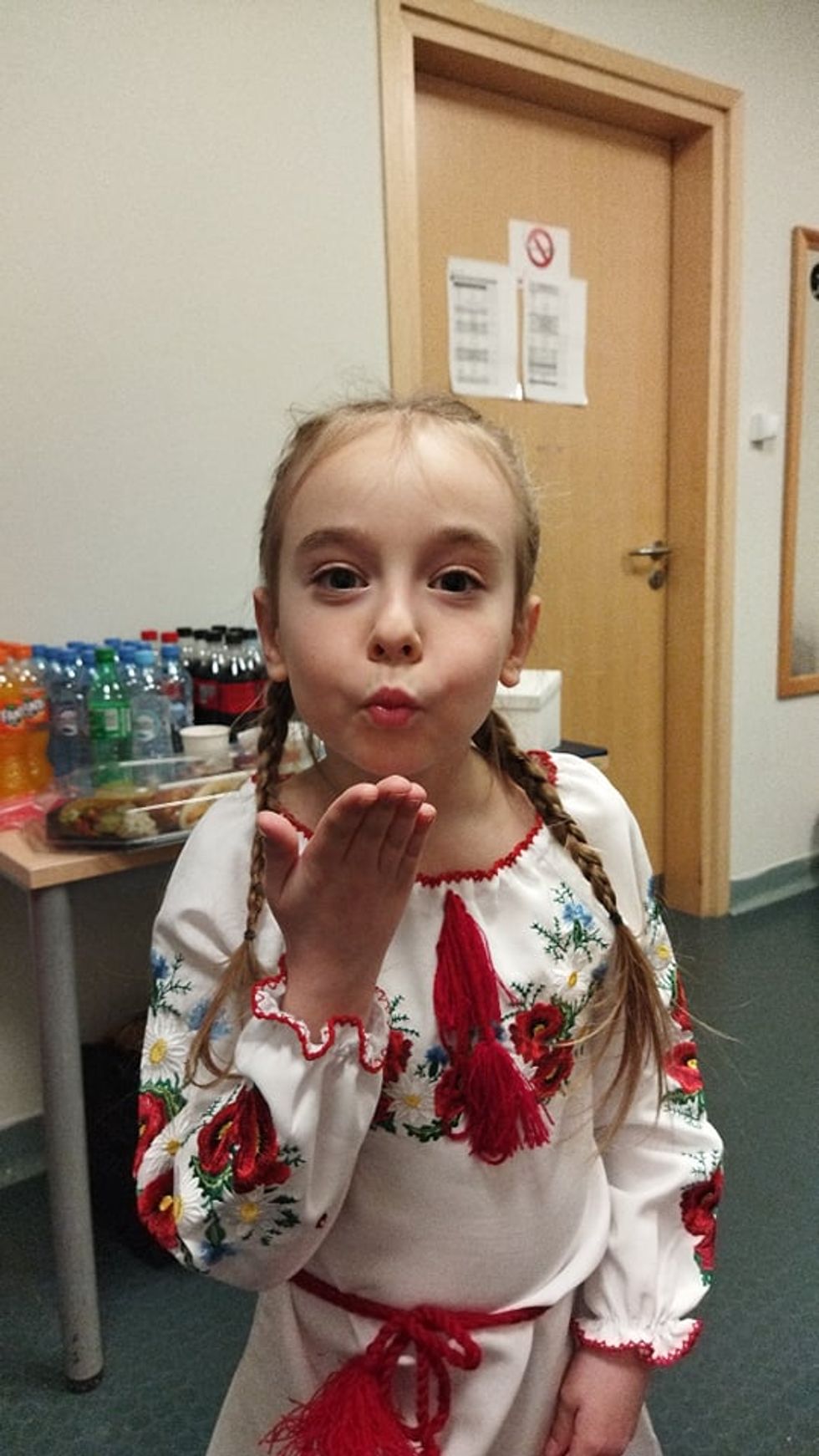 Amelia Anisovych, seven, sang the Ukrainian national anthem whilst dressed in a traditional embroidered dress