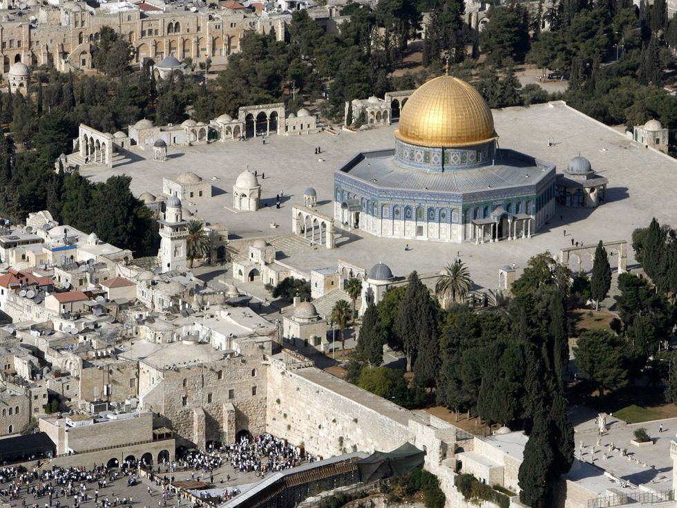 An aerial view shows the Dome of the Rock (R) on the compound known to Muslims as the Noble Sanctuary and to Jews as Temple Mount, and the Western Wall (L) in Jerusalem's Old City