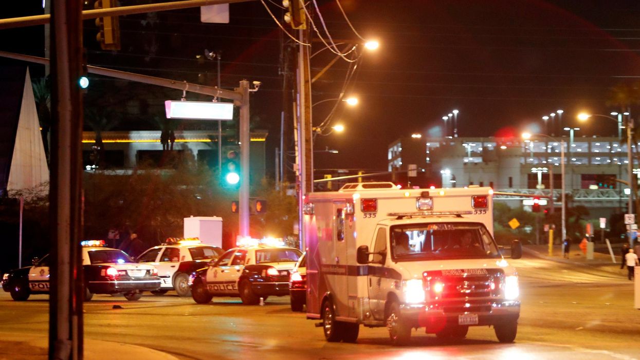 An ambulance leaves the concert venue after a mass shooting at a music festival on the Las Vegas Strip