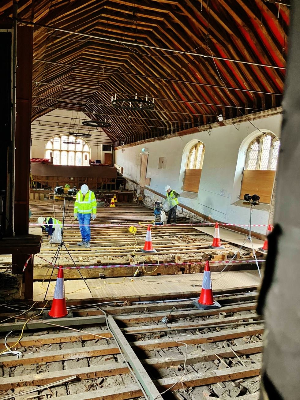 An area of historic timber floor larger than the size of a tennis court has been exposed at St George\u2019s Guildhall in King\u2019s Lynn, Norfolk as part of a heritage project. (St George's Guildhall/ PA)