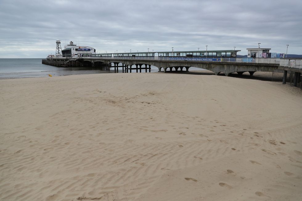 An empty beach and pier at Bournemouth in Dorset